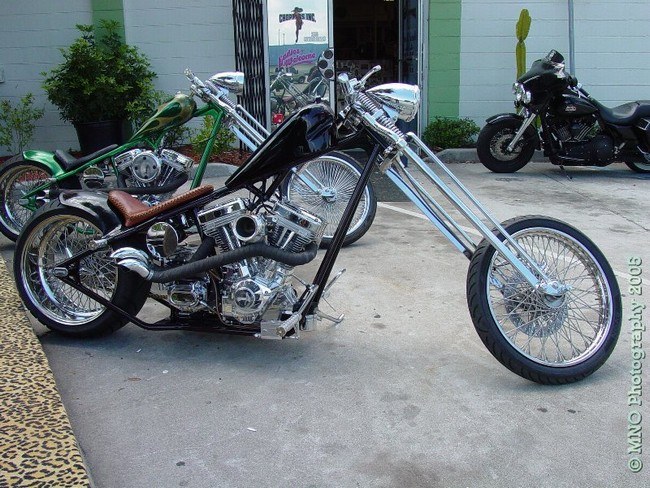 View of two choppers sitting by the front door.