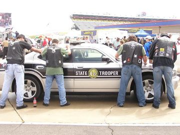 All Right-C- Hands on the Car and Spread em...